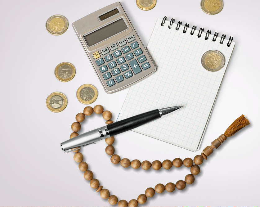 Debt treatment in Hanafi Zakat calculations, with classical full debt deduction, modern distinction between short and long-term debts, and practical rule of deducting only twelve months of installments.